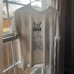 Size men’s small (women’s medium) beige Obey t shirt